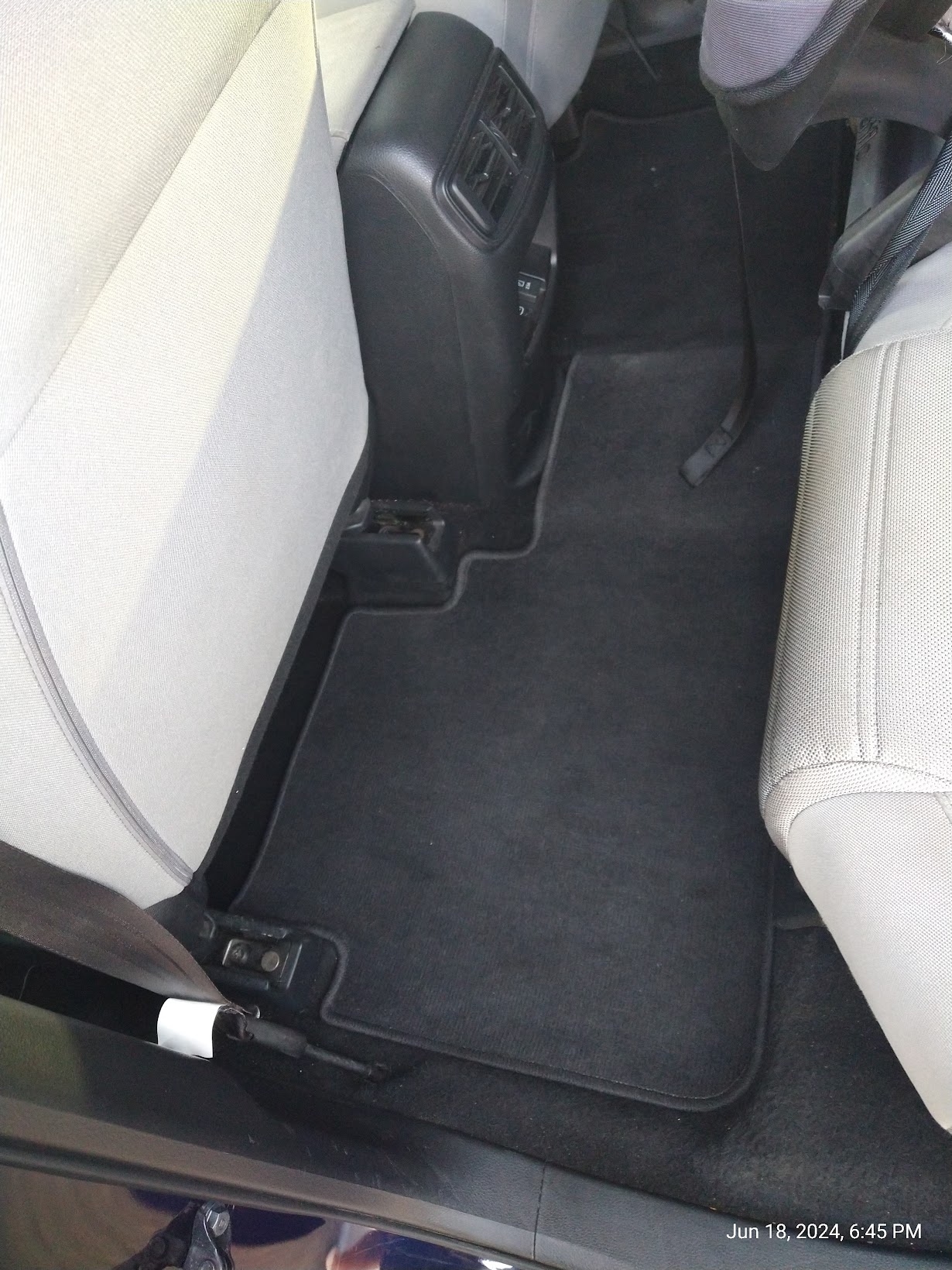 Clean interior floor mats and rear seats after detail